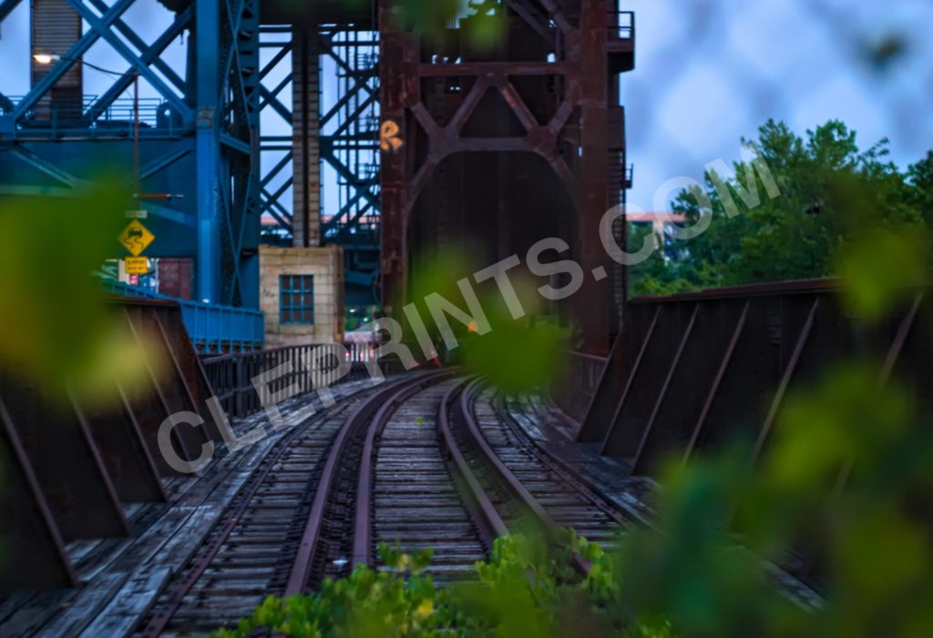 Abandoned Railway Bridge In Cleveland Ohio Flats Through A Fence